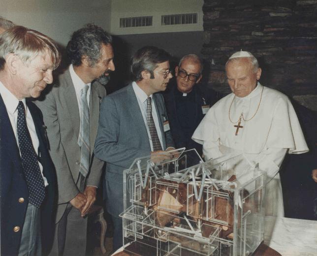 Pope John Paul II visiting Arizona, with members of the Arizona astronomy department describing their plans for an observatory including a telescope for the Vatican, 1987.