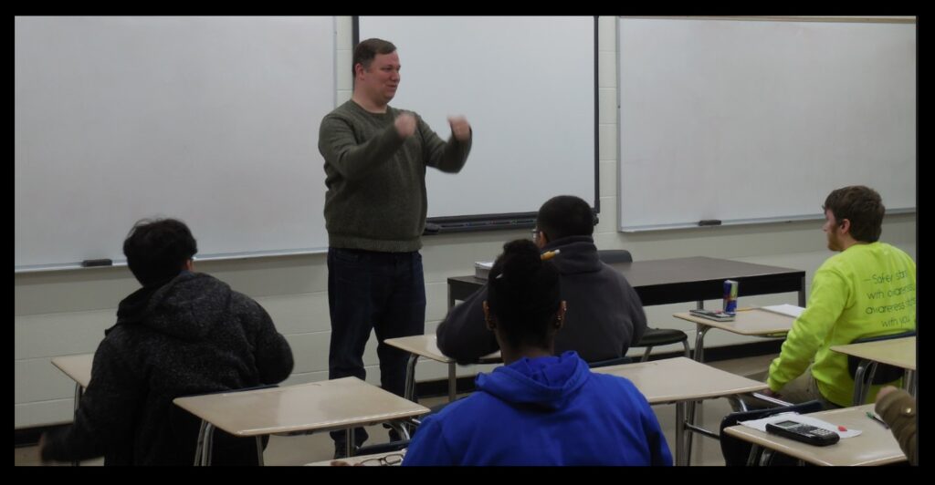 Chad in the classroom, getting a point across to his students.