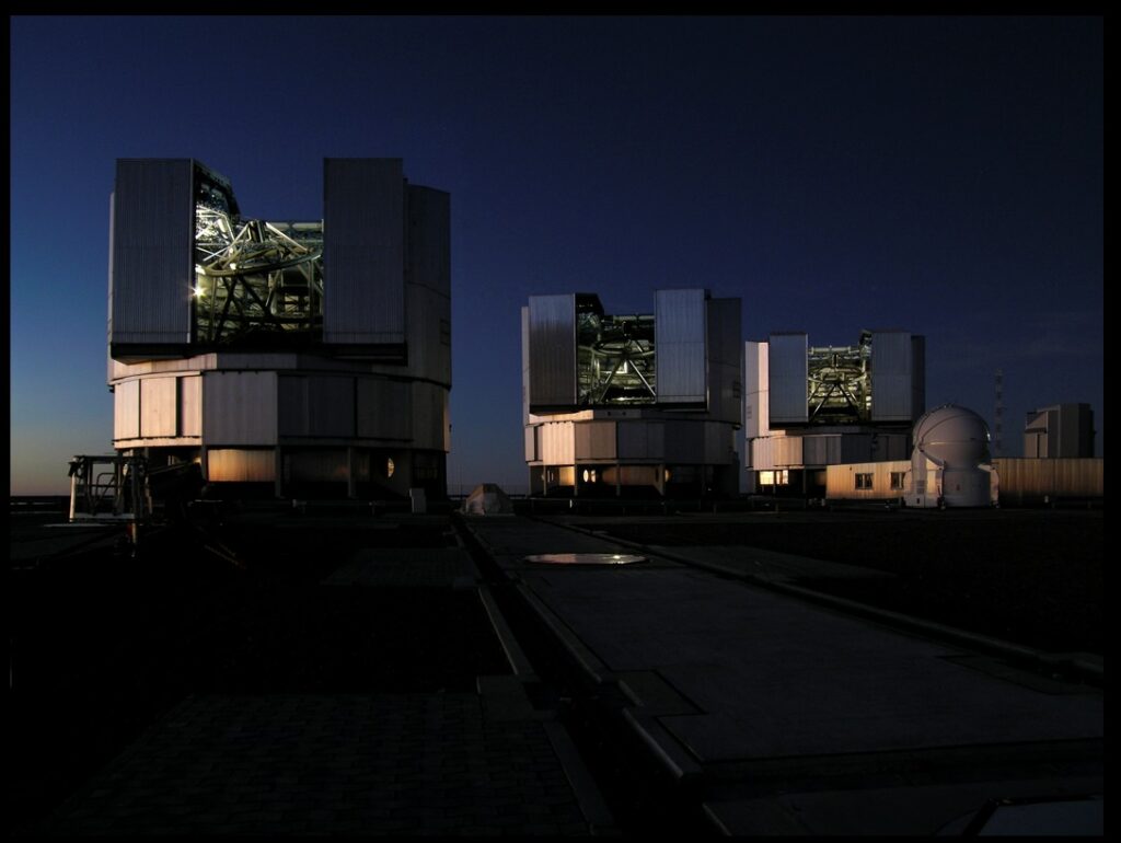 Three of the units of the Very Large Telescope (VLT), each one being among the most powerful telescopes on our planet, get ready for a night of observing under the fantastic skies of Paranal, a mountain peak in the extremely arid Northern Atacama desert in Chile. (Credit: ESO)