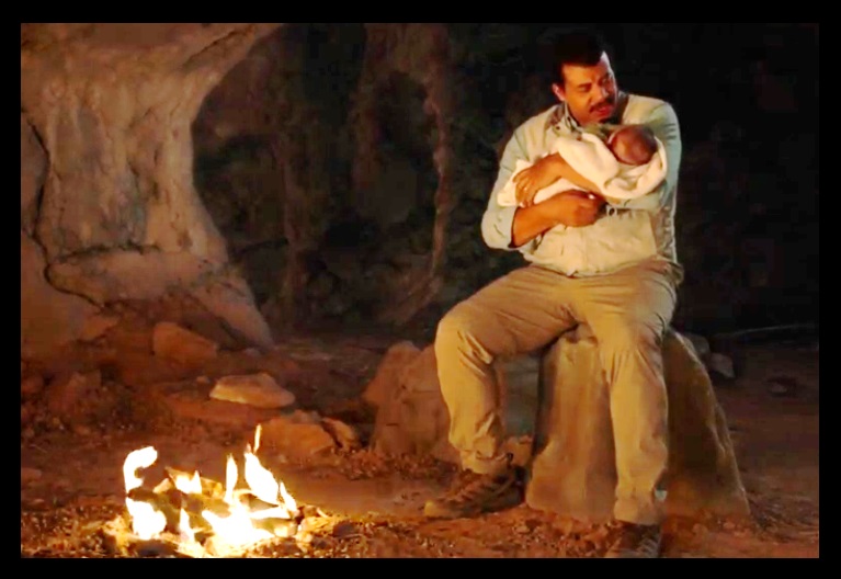 Tyson and baby.  That rock he is sitting on came from the set of the original Star Trek, right?