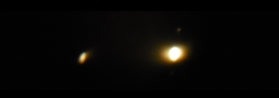 This lousy photo shows the difference in brightness between Saturn (on the left) and Jupiter.