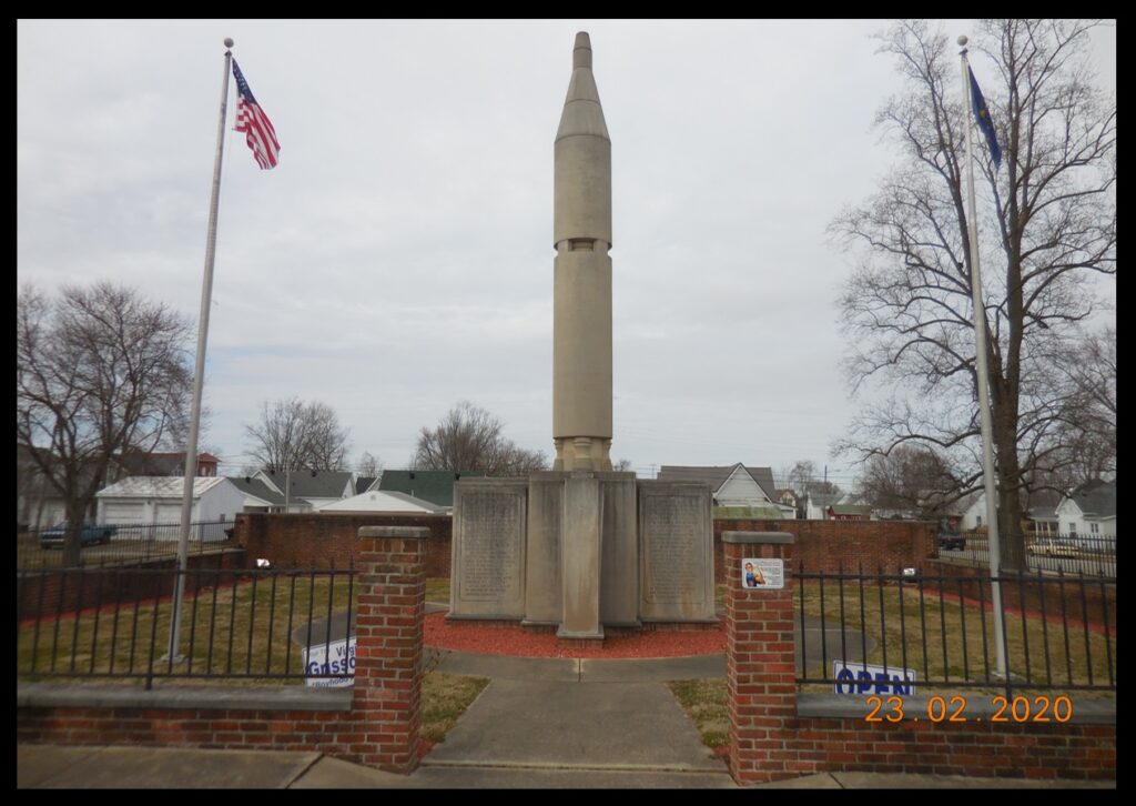 The Virgil I. Grissom monument in Mitchell, Indiana. The monument stands on the site of Riley School, where Grissom received his grade school education (grades 1-6). The brick walls that encircle the monument are constructed from bricks taken from the school.