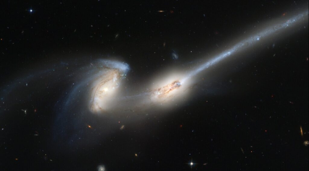 Two galaxies colliding. This is truly a “slow-motion train wreck”—it will take a very, very long time before we see any change in this picture.