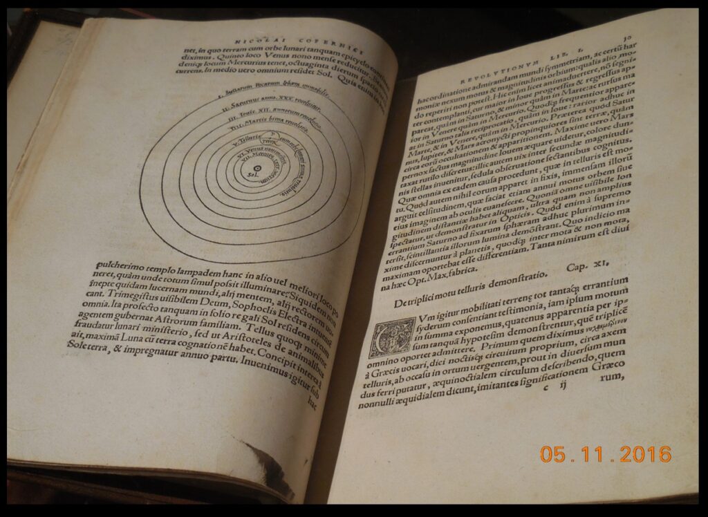 A closer photo of the Bullitt Collection’s copy of De Revolutionibus—open, of course, to the iconic diagram of the heliocentric system.  This book was printed in 1543, so it is nearly 500 years old, yet it looks “like new.”  So, readers of The Catholic Astronomer, can you read the Latin?  Many of the books in the exhibit are written in Latin, which was the international language of science for a long time.