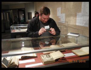 Prof. Chad Howard of Jefferson Community & Technical College, with some of the rare math and science books in the University of Louisville’s Bullitt Collection.