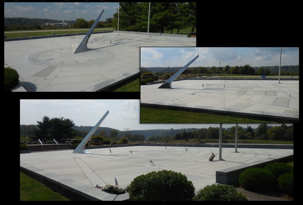 Names of veterans are inscribed on the stone surface upon which falls the shadow of the sundial’s gnomon (the large central silver pointer).