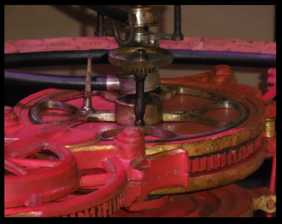 This machinery at the center of the orrery drives the motions of Mercury, Venus, and the Sun.