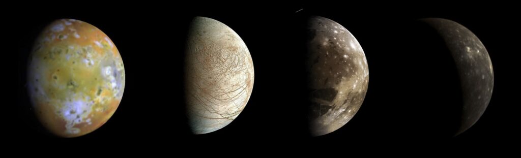 Jupiter’s moons (from left to right) Io, Europa, Ganymede, and Callisto, as seen by various NASA probes that were in position to see their unlit halves. These moons do indeed show phases; Locher’s reasoning was right on the money.