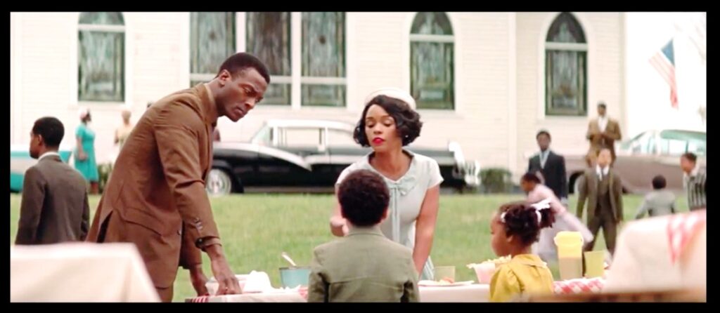 Mary Jackson and her family at a church picnic in the movie version of Hidden Figures.