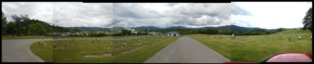 A composite panoramic shot of the crater, spanning over 180 degrees from left to right. The crater edge is seen in all directions from within Middlesboro.