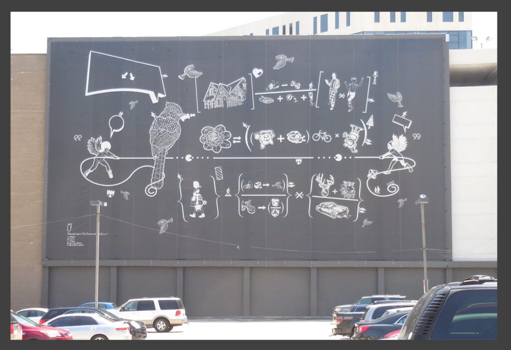 The mathematics-themed mural by Reginald Baylor near the corner of 4th and Wisconsin streets.  It has the lengthy title “The Answer to the Area… A.) Persons B.) Places C.) Things D.) All of the Above E.) None of the Above.”  Addition, subtraction, multiplication, division, raising to a power, order of operations—all are suggested here.  Mathematics in public!  I thought Public Displays of Mathematics were banned by law in most states.  Good for Milwaukee and Wisconsin!!