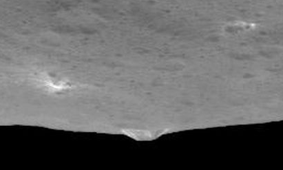 Dawn Survey Orbit Image 10 showing a side view of the mountain, and a light area. Image credit: NASA/JPL-Caltech/UCLA/MPS/DLR/IDA