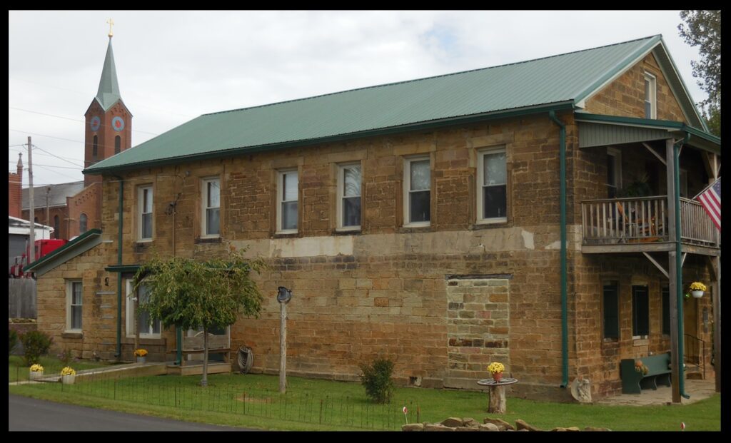 Side view of the former Nester’s Hotel. The steeple in the background is St. Pius V church in Troy.