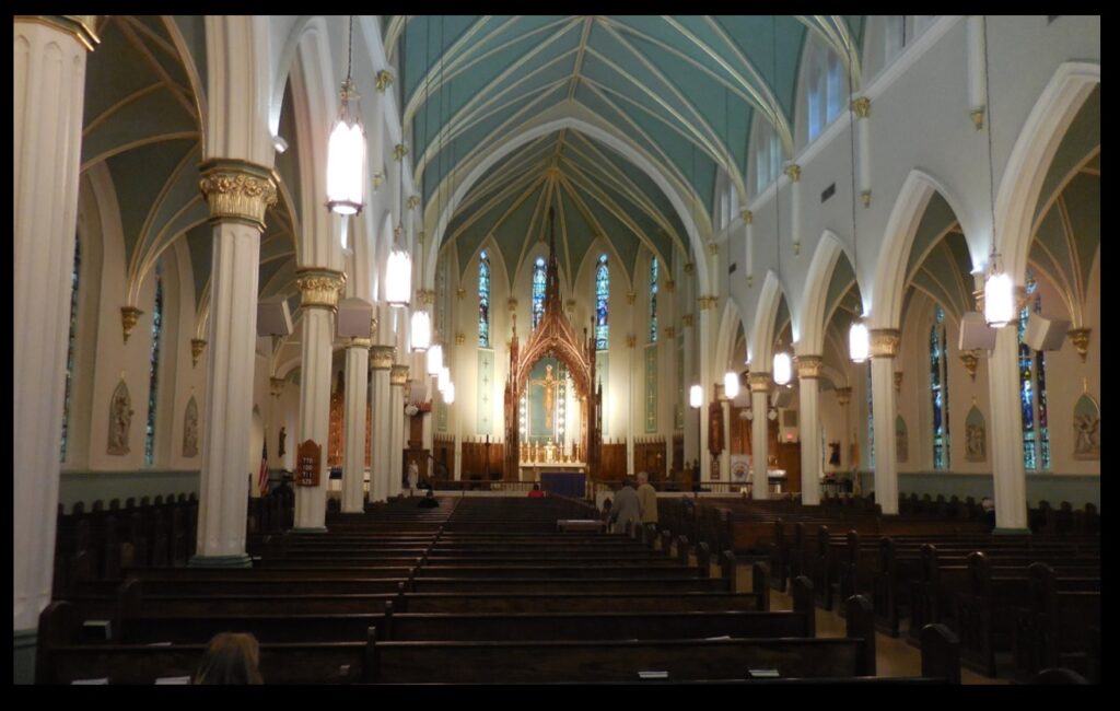 The interior of St. Louis Bertrand Church. Note the large baldacchino over the altar.