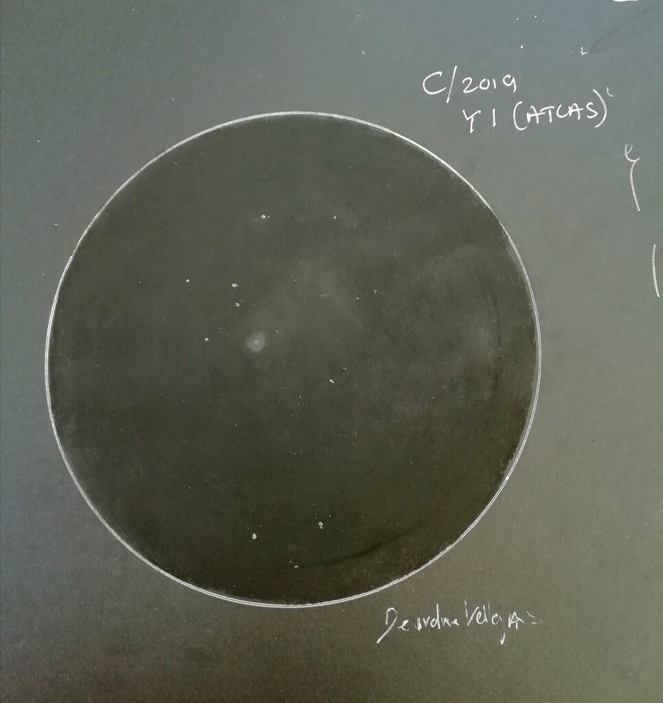 My sketch of C/2019 Y1 (ATLAS) 20th/21st April - 23:49 Local Time - 00.05 Local Time 22:49 UT - 23:05 UT Meade LX90 - 200mm / 32 mm eyepiece/ 2000 mm FL/ 62X - est 8 mag maybe a tad brighter, no colour visible to the eye, Central condensation DC 4 est, circular coma, no tail visible to my eye at the time of the drawing. Cassiopeia.