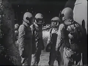 Space-suited astronomers arrive at the lunar observatory.  Copyright 1959 Ziv Television Productions.