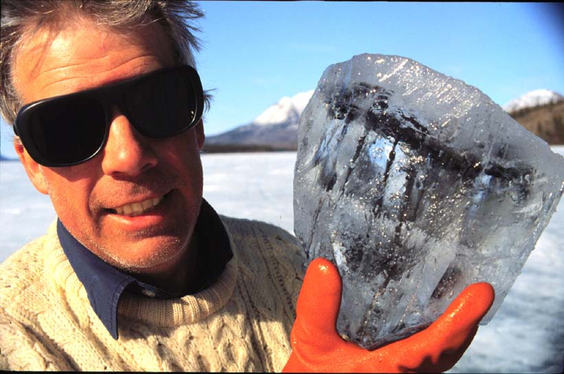 Alan Hildebrand holding a chunk of ice with has within it pieces of the meteorite now known as Tagish Lake, which fell during the winter of 2000 in northern Canada